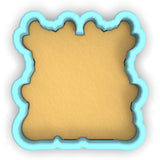 a cookie shaped like a bear with a blue frame