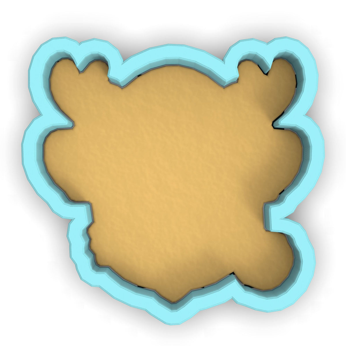 a cookie cutter with a cookie shaped like a bear