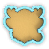 a cookie cutter with a cookie shaped like a bear