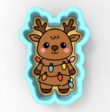 A cookie cutter in the shape of a reindeer, decorated with colorful Christmas lights.