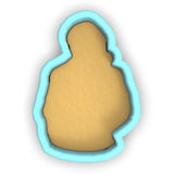 a cookie cutter with a cookie in the shape of a man