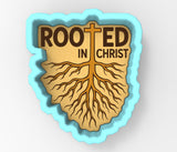 a logo with the text "ROOTED IN CHRIST" and a tree-like symbol with roots, all set against a light blue background.