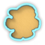 a cookie cutter with a cookie in the shape of a flower