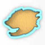 a cookie cutter shaped like a fish