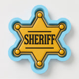 A sheriff badge with the word "SHERIFF" prominently displayed in the center.