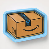 A cardboard box with a smiley face and a blue Amazon Prime shipping label on it.