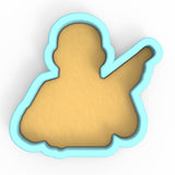 a cookie shaped like a person holding a baseball bat