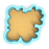 a cookie cutter with a cookie shaped like a flower