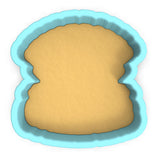 a cookie cutter with a cookie inside of it