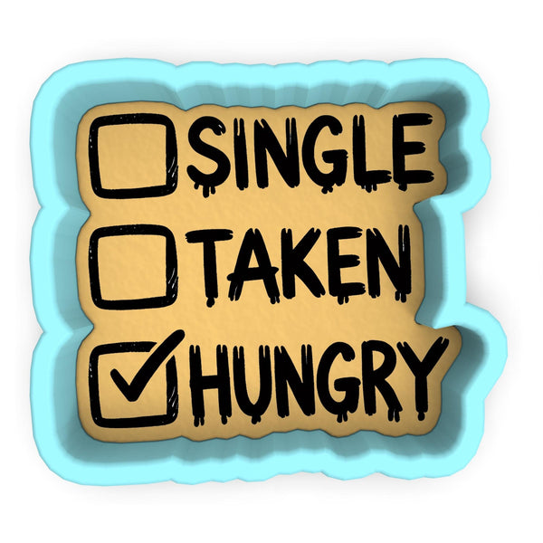 a sticker with the words single, taken, hungry written on it