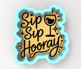 a sticker that says sip sip hooray