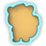 a cookie shaped like a bear with a blue outline