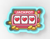 A colorful illustration of a slot machine with three red hearts on the reels, surrounded by gold coins.