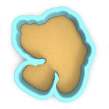 a cookie cutter with a cookie in the shape of a bear