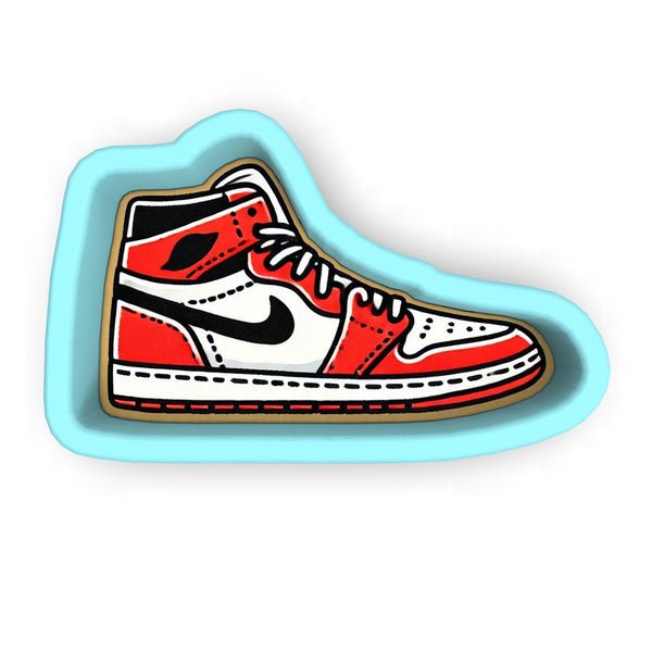 a sticker of a red and white shoe