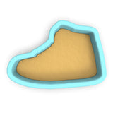 a cookie cutter shaped like a shoe