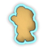 a cookie shaped like a teddy bear on a white background