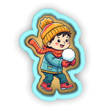 a little boy holding a snowball in his hands