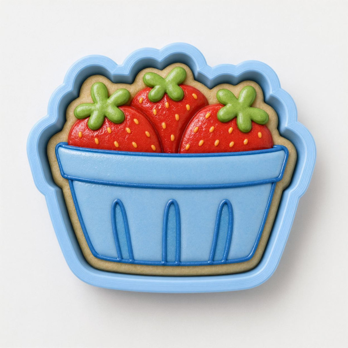 A blue cookie cutter shaped like a basket, with three decorated cookies inside.