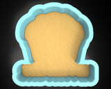 a cookie cutter with a cookie in the shape of a chair