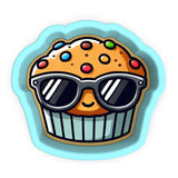 a cupcake with sunglasses on top of it