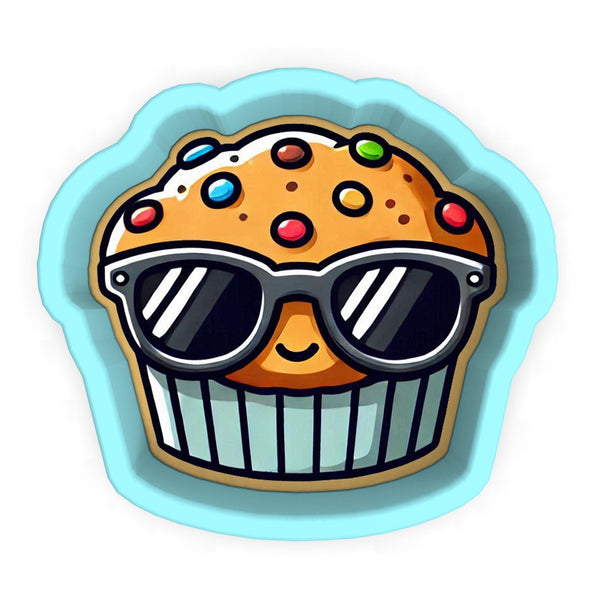 a cupcake with sunglasses on top of it