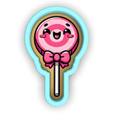 a pink lollipop with a bow on it