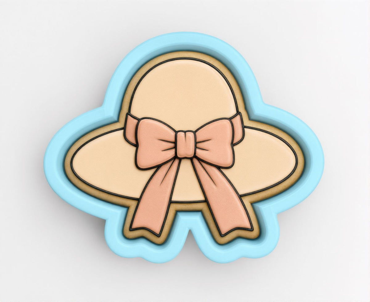 A cookie cutter in the shape of a hat with a bow on it.