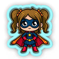 a little girl dressed as a super hero