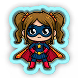 a little girl dressed as a super hero