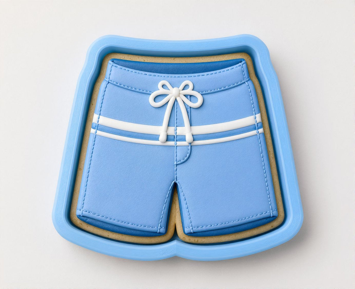 A blue cookie cutter shaped like a pair of blue swim shorts.