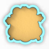 a cookie cutter with a cookie in the shape of a cookie