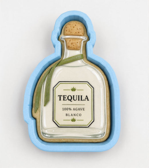 A blue cookie cutter shaped like a bottle of tequila, with a label that reads "100% AGVEC BLANCO".