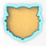 a cookie cutter with a cookie in the shape of a bear