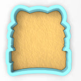 a cookie cutter with a piece of bread in it