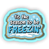 a cookie saying it's the season to be freezen