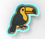 A bird with a yellow beak and black body is depicted in the image.