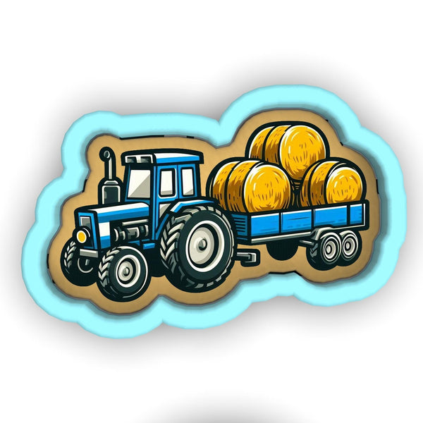 a blue tractor with a trailer of hay