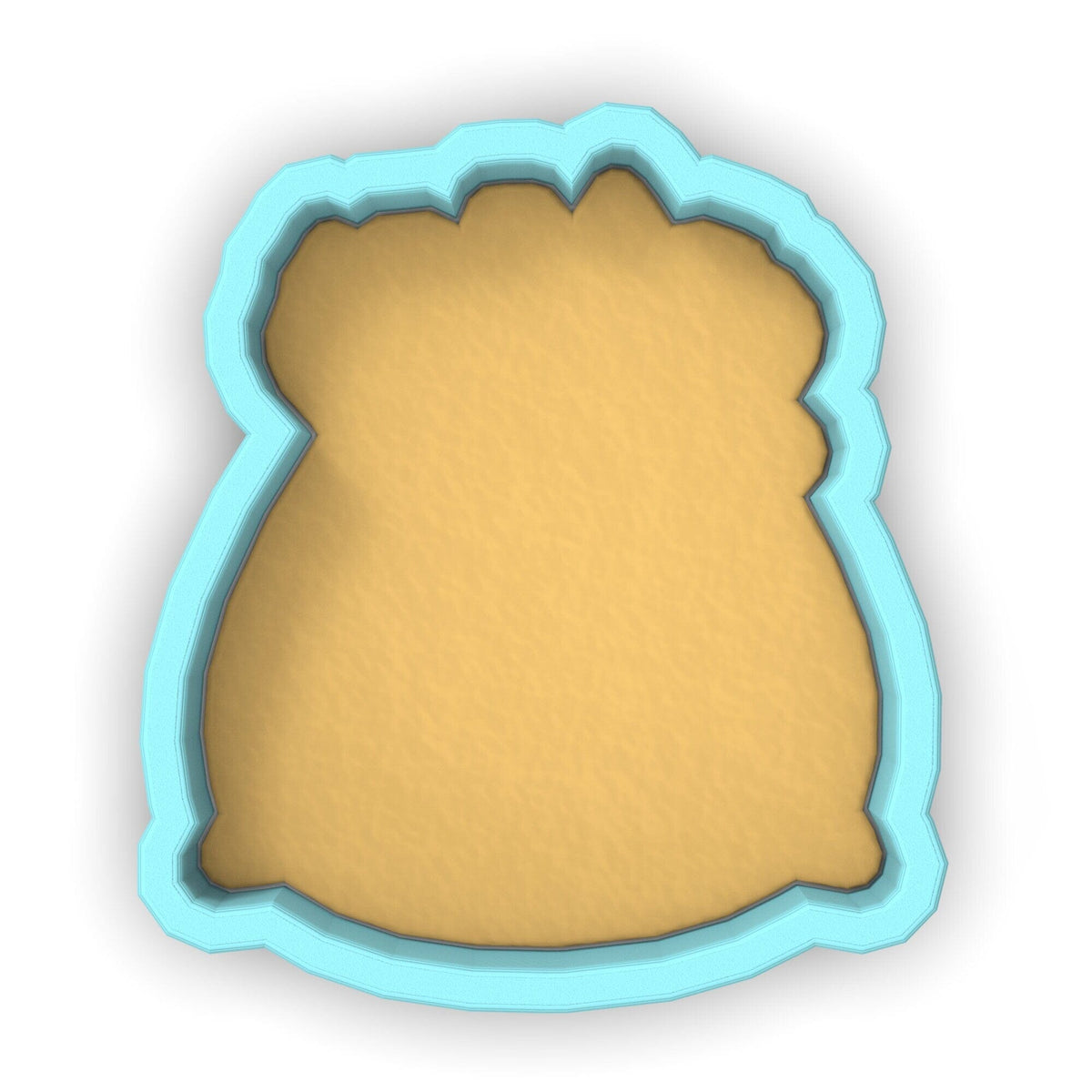 a cookie cutter with a cookie in the shape of a bag