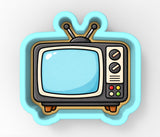 A cartoon-style television set with a blue and white color scheme, featuring a screen, antennae, and control buttons.