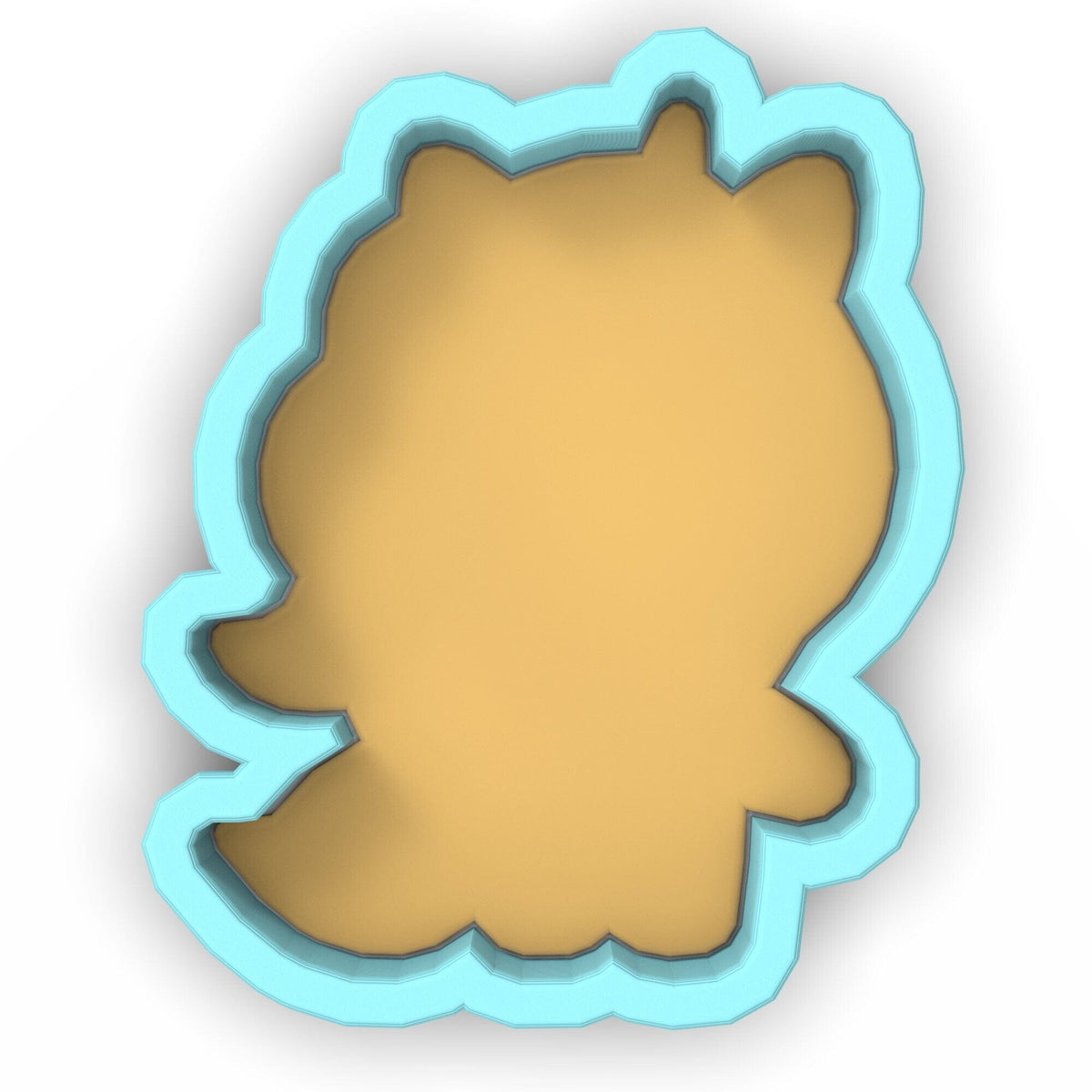 a cookie cutter with a cookie in the shape of a bear