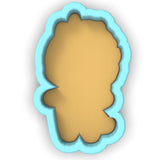 a cookie cutter shaped like a silhouette of a woman