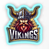 a sticker of a viking with a beard and helmet