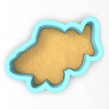 a cookie shaped like a fish on a white background