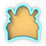 a cookie cutter with a cookie shaped like a hat