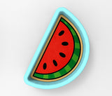 A blue bowl with a watermelon slice design on it.