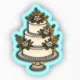 a three tiered cake with flowers on it