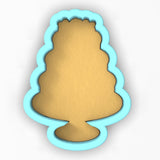 a cookie shaped like a christmas tree