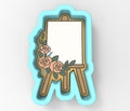 A 3D rendering of a white canvas on a wooden easel, decorated with pink roses and green leaves.