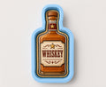 A cookie cutter shaped like a bottle of whiskey.